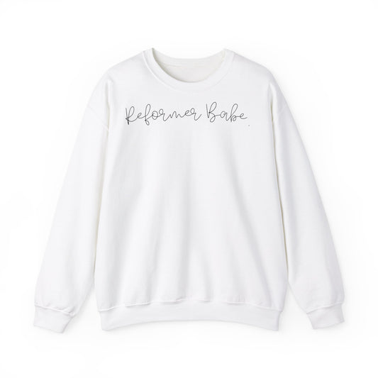 Unisex crewneck sweatshirt with the text "Reformer Babe" in a minimalist, stylish font. Perfect for pilates lovers and casual wear.